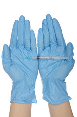 Syringe with on palms in gloves of nurses
