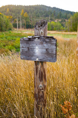 Blank Wooden Sign in Field