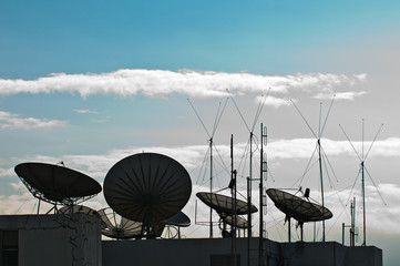 satellite dish and antenna on building