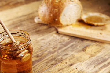 Breakfast with honey, healthy food on wooden table