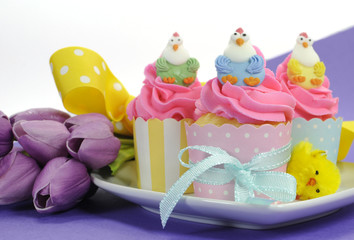 Happy Easter pink, yellow and blue cupcakes
