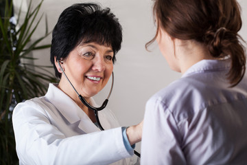 Doctor examines patient