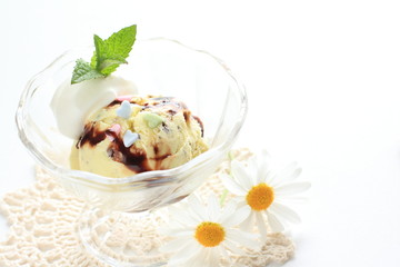 Vanilla ice cream with flower on background