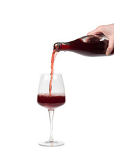 Bottle filling a glass of wine