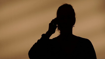 Female silhouette calling on the phone - Powered by Adobe