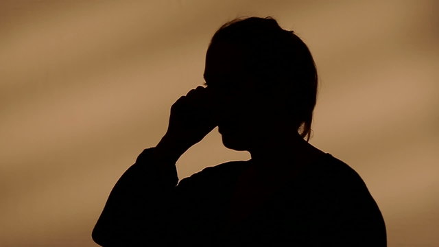 Female silhouette calling on the phone