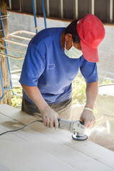 carpenter s hands sanding plank using power