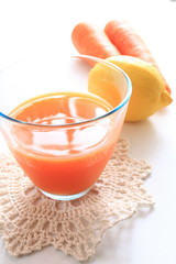 carrot juice on white background with copy space