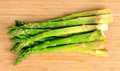 delicious asparagus on wooden background