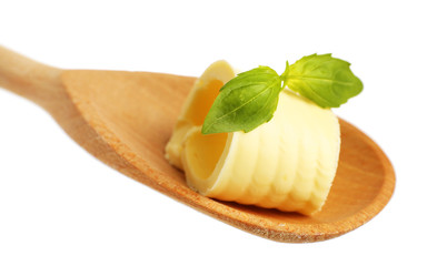Curl of fresh butter with basil