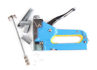 Construction stapler and staples isolated on white
