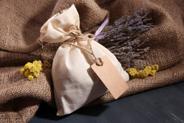 Textile sachet pouch with dried flowers, herbs