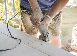 carpenter s hands sanding plank using power
