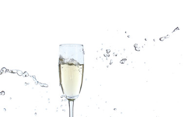 Glass of champagne with splash, isolated on white