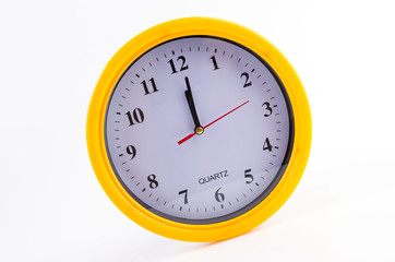 Yellow clock alarm isolated on white background