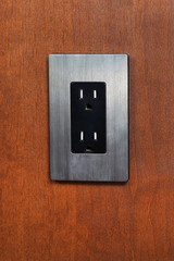 Dual Electrical Outlet on Wooden Wall