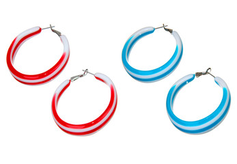 blue and red plastic earrings isolated on white
