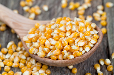 corn in wooden spoon