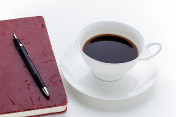 Coffee Cup and grunge red notebook
