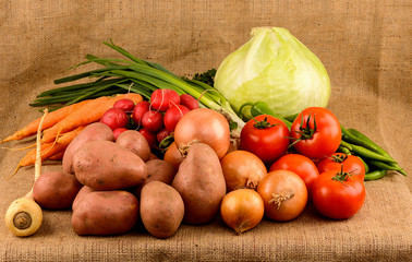 Fresh vegetables on burlap background
