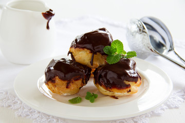 profiteroles with cream and chocolate sauce.