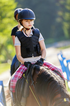 Horse riding, portrait of lovely equestrian on a horse - riding