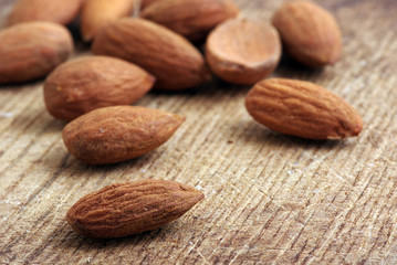 Almonds on wooden background