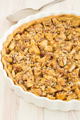Delicious fresh baked  apple pie on a wooden surface