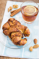 Breakfast with croissants and cup of tea