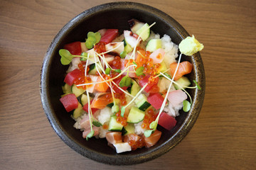 Sushi don , raw salmon tuna octopus on rice
