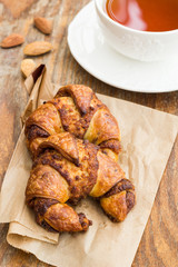 Breakfast with croissants and cup of tea