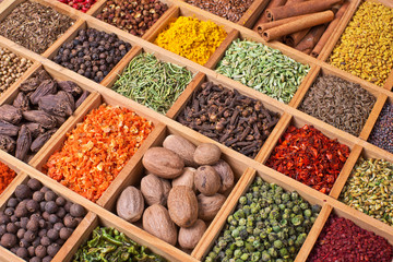 wooden box with spices and herbs