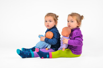 Twin Babies with Dolls