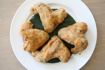 Fried chicken on wood background