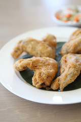 Fried chicken on wood background