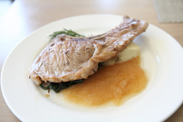 Grilled Porkchop on wood background