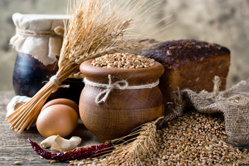 Bread rye spikelets on an old background