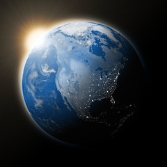Obraz na płótnie Canvas Sun over North America on planet Earth