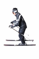 Fototapeta premium One male skier skiing with full equipment on a white background