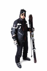 Fototapeta na wymiar One male skier posing with full equipment on a white background