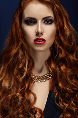 Fototapeta premium Beautiful portrait of a girl with red hair.