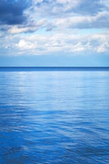 Fototapeta premium Calm Baltic sea with reflected blue sky