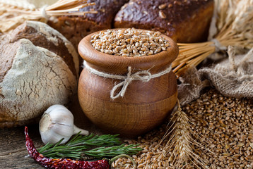 Bread rye spikelets on an old background