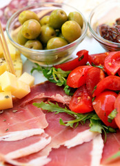 Sliced cold cuts (prosciutto, olives, cheese)