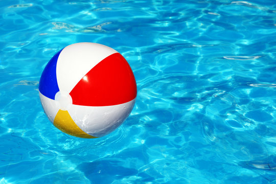 Beach ball in swimming pool