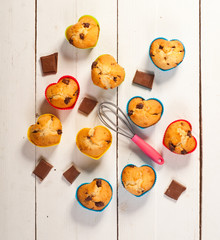 Prepare muffins. Muffins in colorful silicone molds on white boa