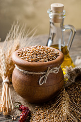 Bread rye spikelets on an old background