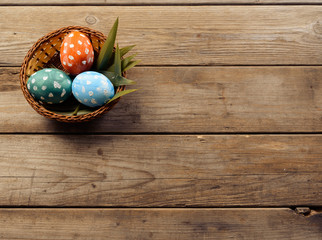 Easter eggs in a basket, copyspace