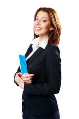 Smiling businesswoman holding notebook and pen