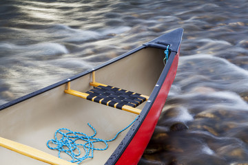 red canoe stern with a rope
